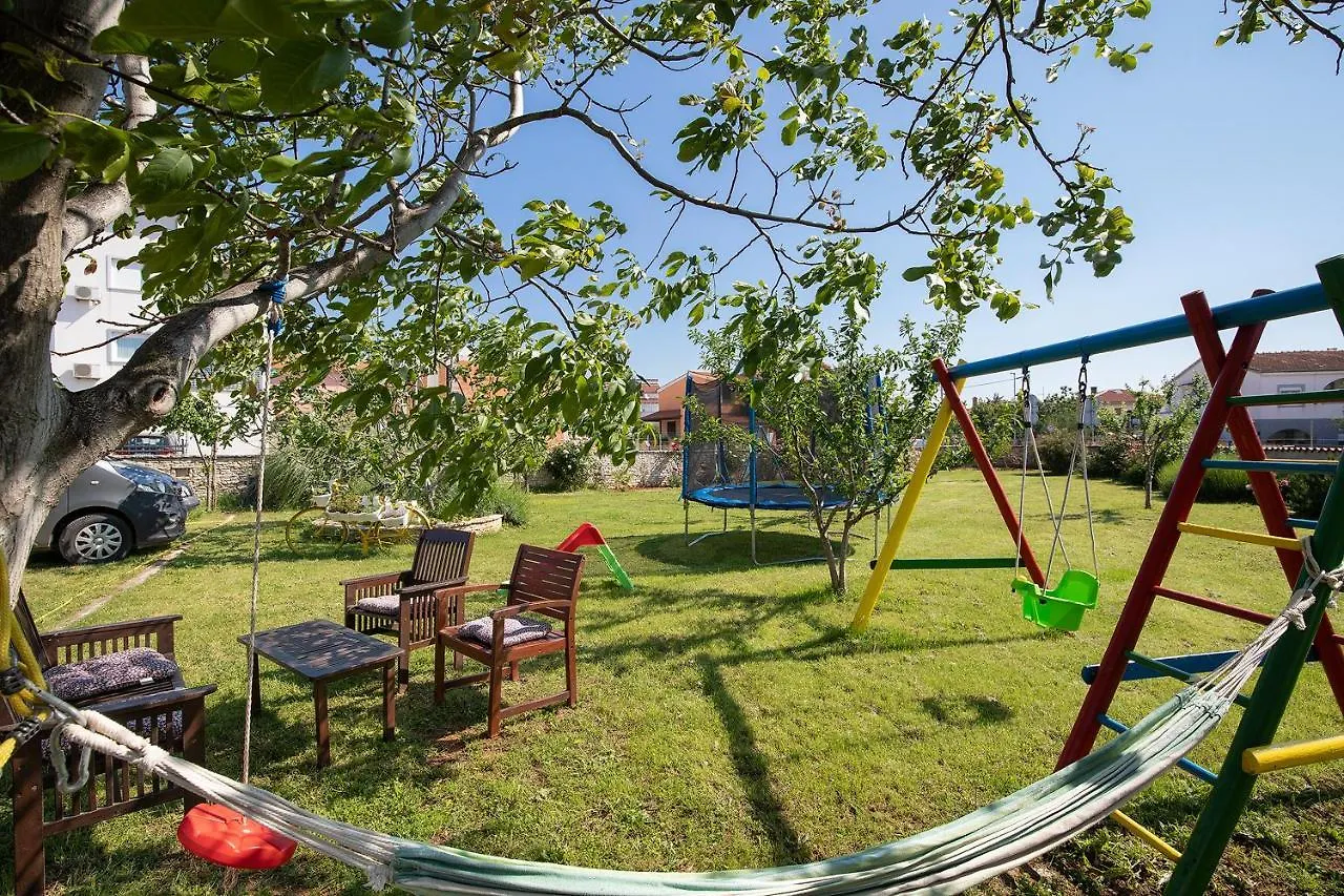 Modern Stone House With Flowers & Playground Medolino